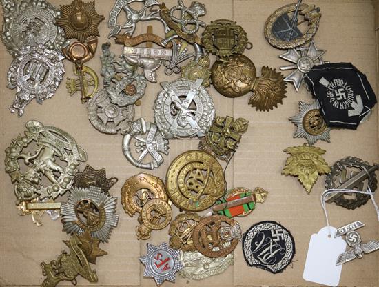 A group of WWI/WWII cap and uniform badges, including Third Reich examples